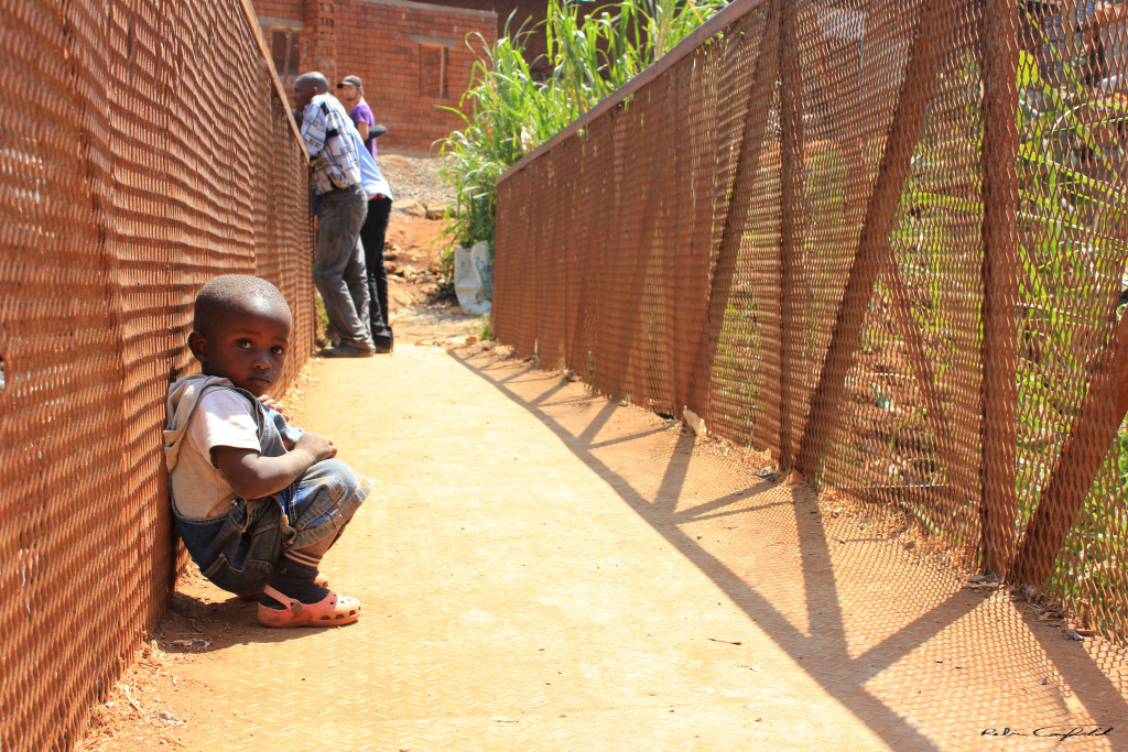 A Boy on the Bridge to Kibera. Nairobi, Kenya.